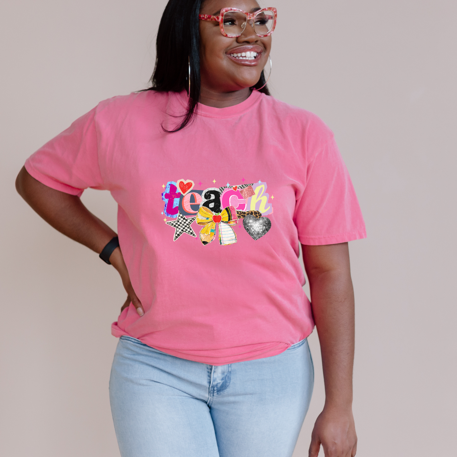 Pink tshirt with a bright retro Teach graphic