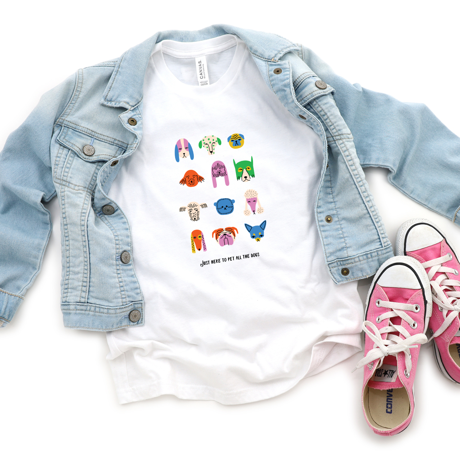 Kids dog lover shirt with cartoon dog faces graphic on bright white youth t-shirt