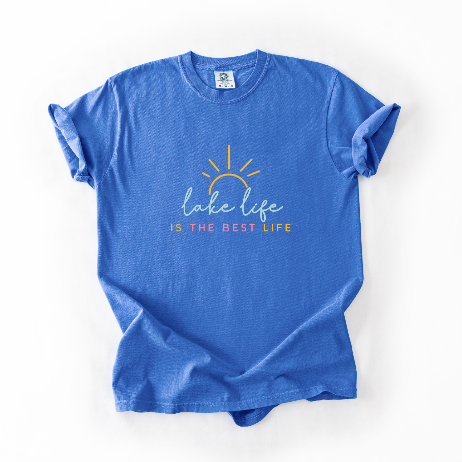 Blue t-shirt with 'lake life is the best life' text and sun graphic on a white background