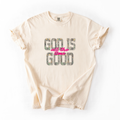 Beige t-shirt with 'God is all the time good' text on a white background