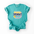 Teal t-shirt with 'happy sunny days' text and sun graphic on a white background
