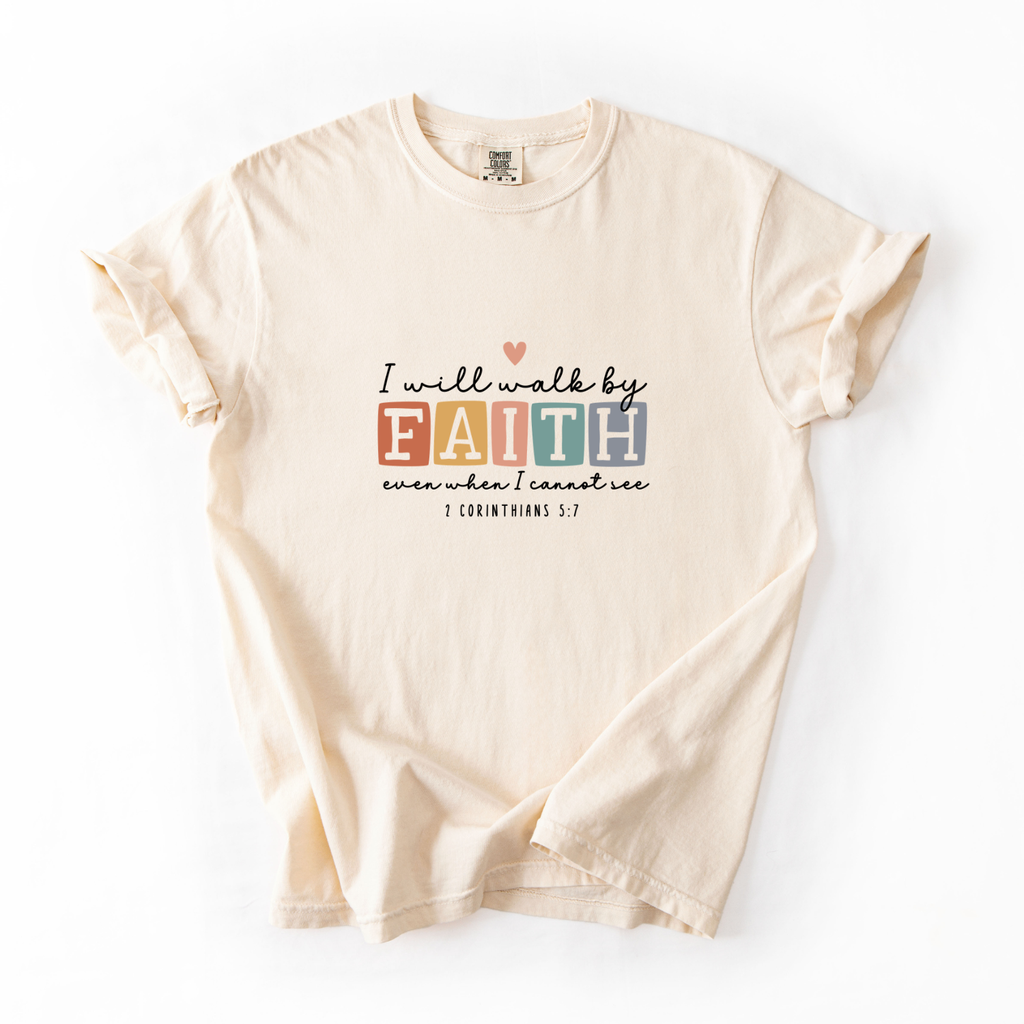 Beige t-shirt with motivational quote on a white background