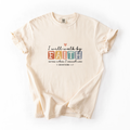 Beige t-shirt with motivational quote on a white background