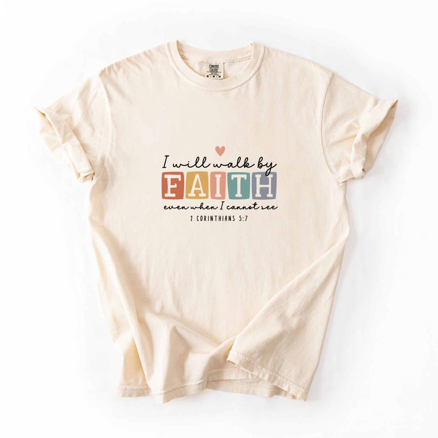 Beige t-shirt with motivational quote on a white background