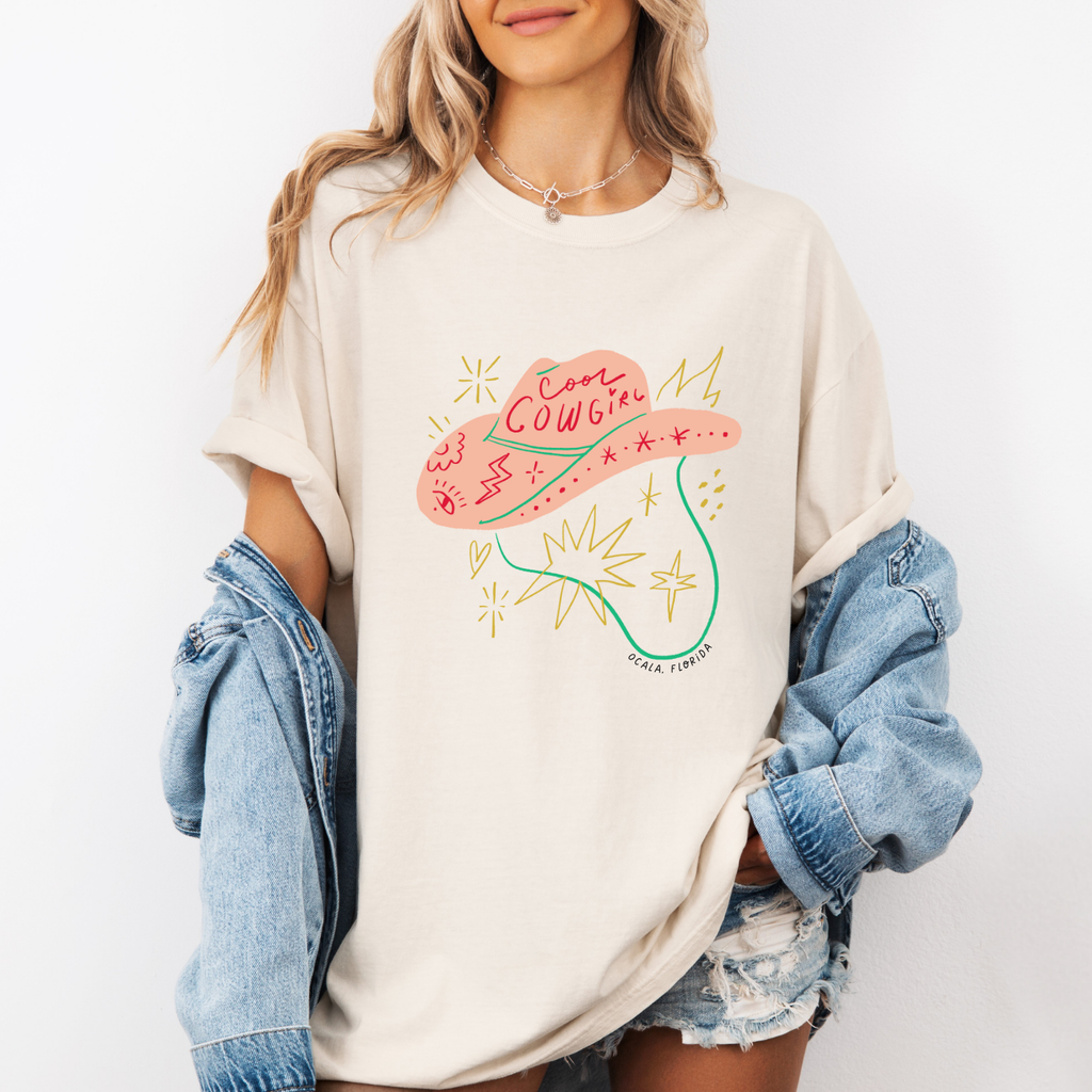 Trendy cool cowgirl tee with modern illustration of a pink cowgirl hat and stars with the text "ocala, florida"