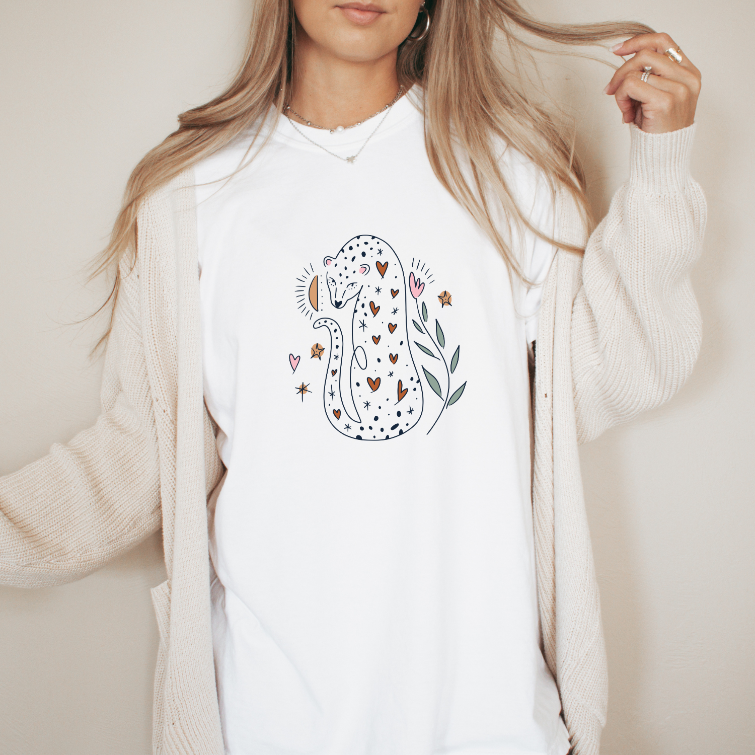 Women's leopard graphic t-shirt with minimalist animal illustration on a soft neutral tee, casual boutique style shirt for animal lovers