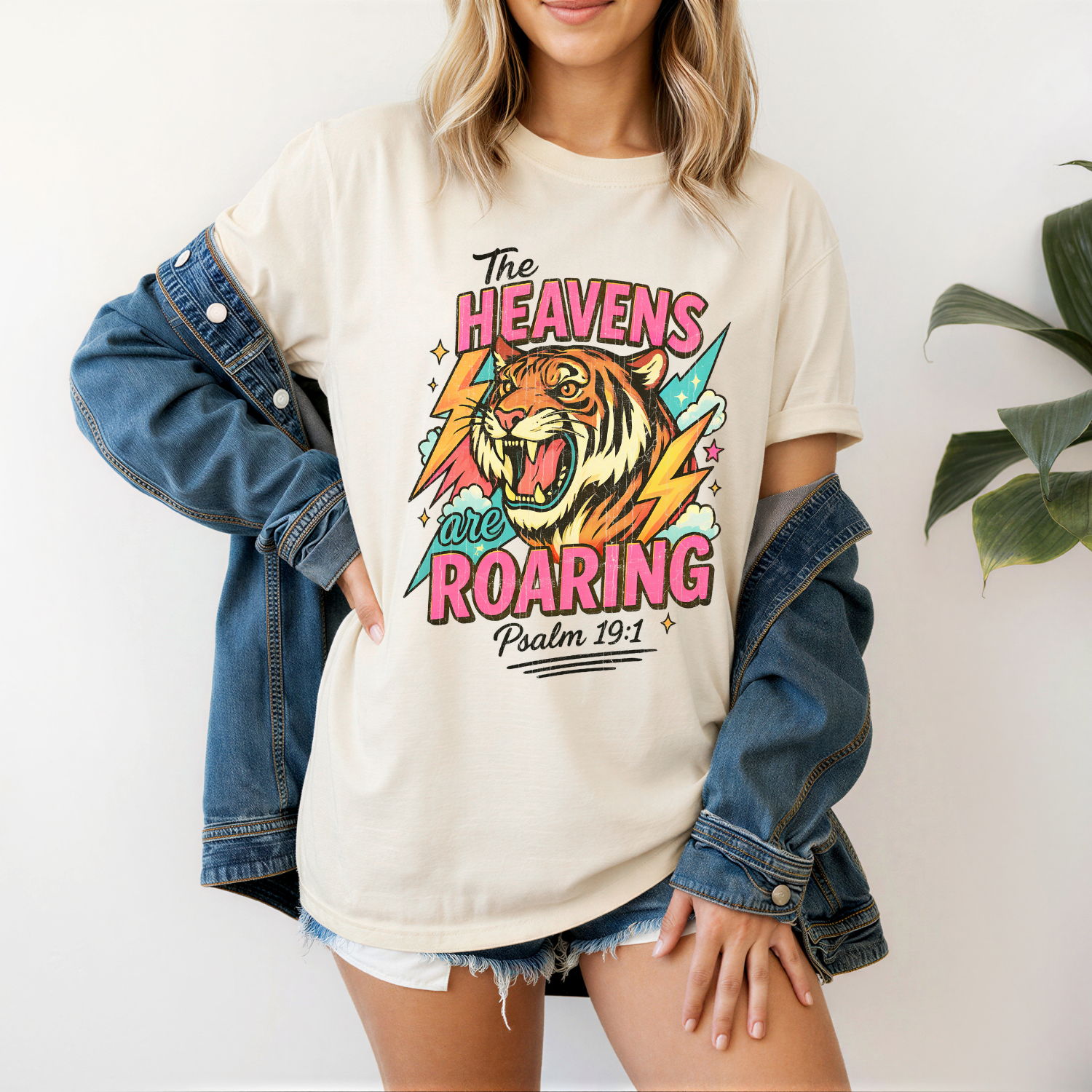 Vintage comfort Colors christian tee with a tiger graphic that says "the heavens are roaring" in bright colors
